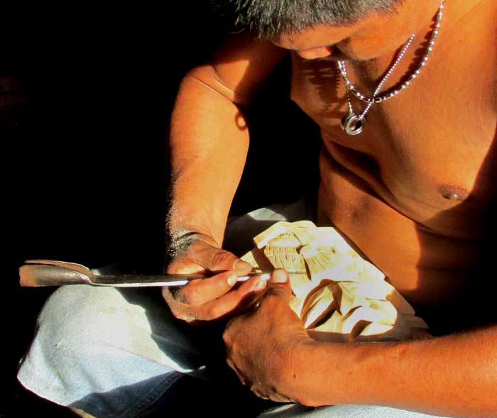carving Maya masks in Yaxunah, Yucatán