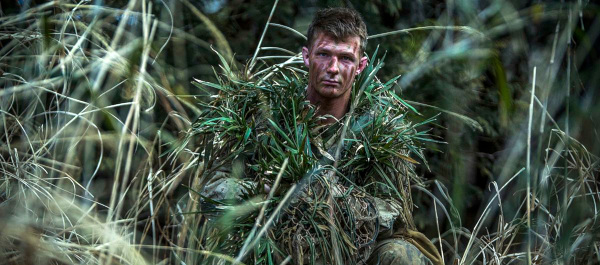 US Marine Lance Cpl. William Pearn, camouflaged during an exercise in Japan; photo by Sgt. Isaac Ibarra, used courtesy of US Marines and Wikimedia Commons