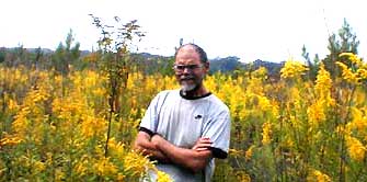 Naturalist Jim Conrad standing among some Canada Goldenrods, image by Karen Wise of Kingston, Mississippi